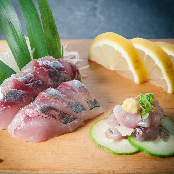 fresh cut sashimi swith lemon and cucumber at Osaka