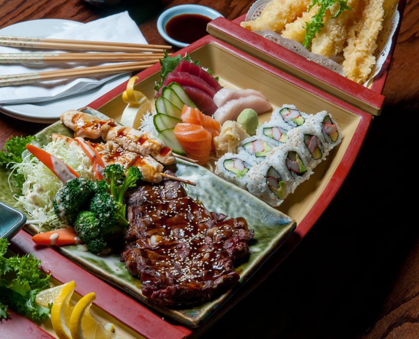 Beef Teriyaki boat with salad, sushi and tempura vegetables