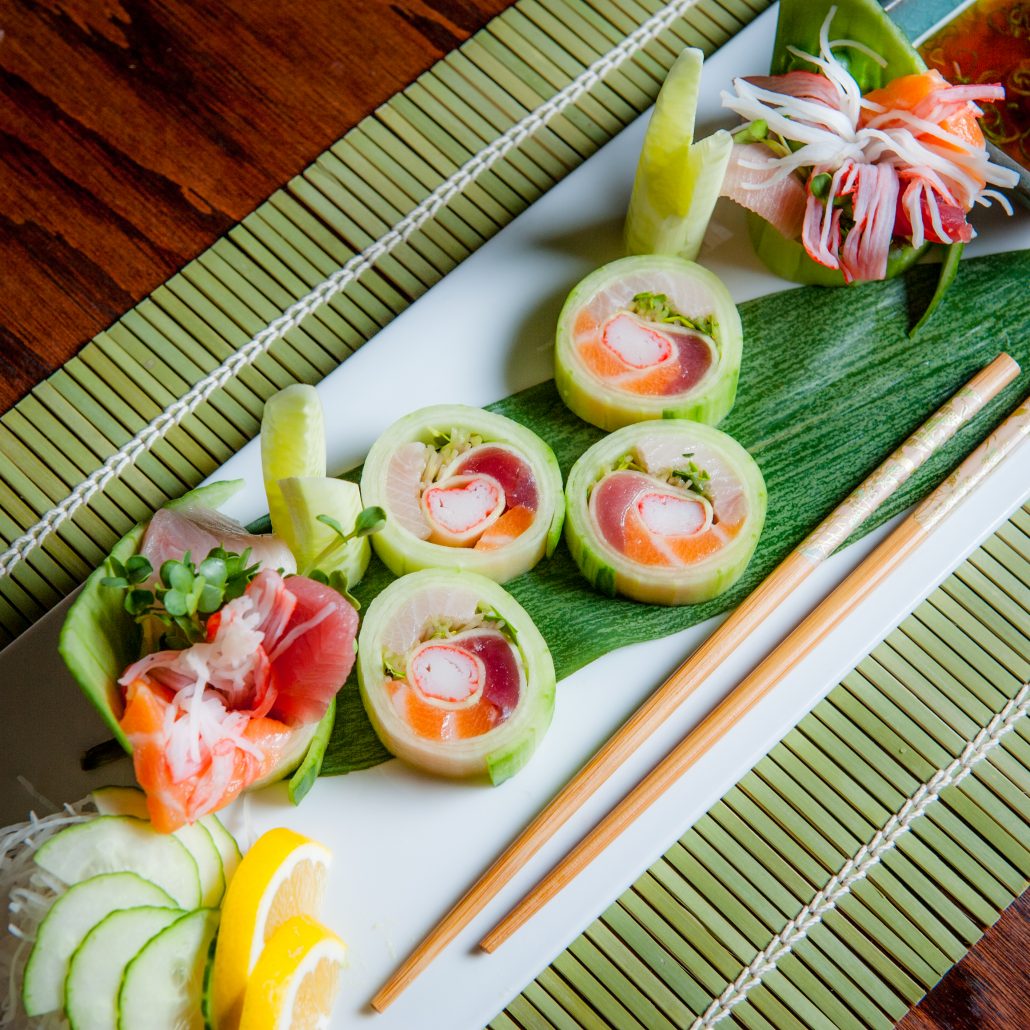 cucumber roll sushi spring green on traditonal green mat