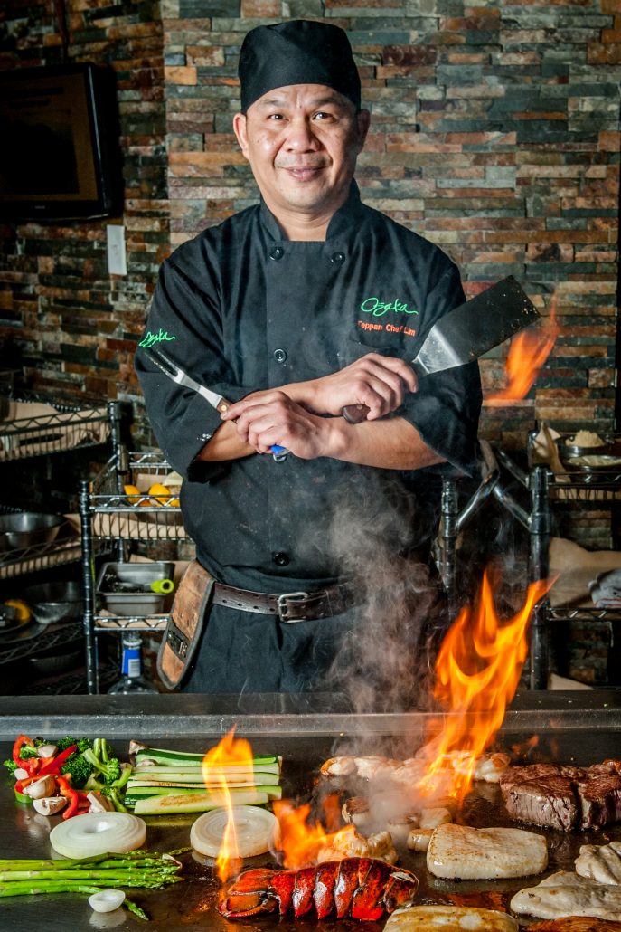 Osaka japanese restaurant teppan yaki chef over flame cooking lobster, steak and other foods