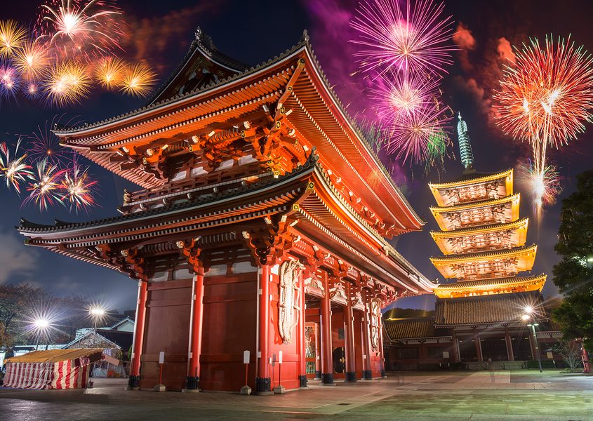 Colorful firework over abstract beautiful temple in japanese style celebrate new year at night time
