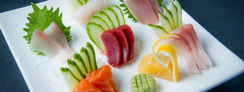 Sashimi plate fresh raw fish presented by Osaka Japanese Bistro